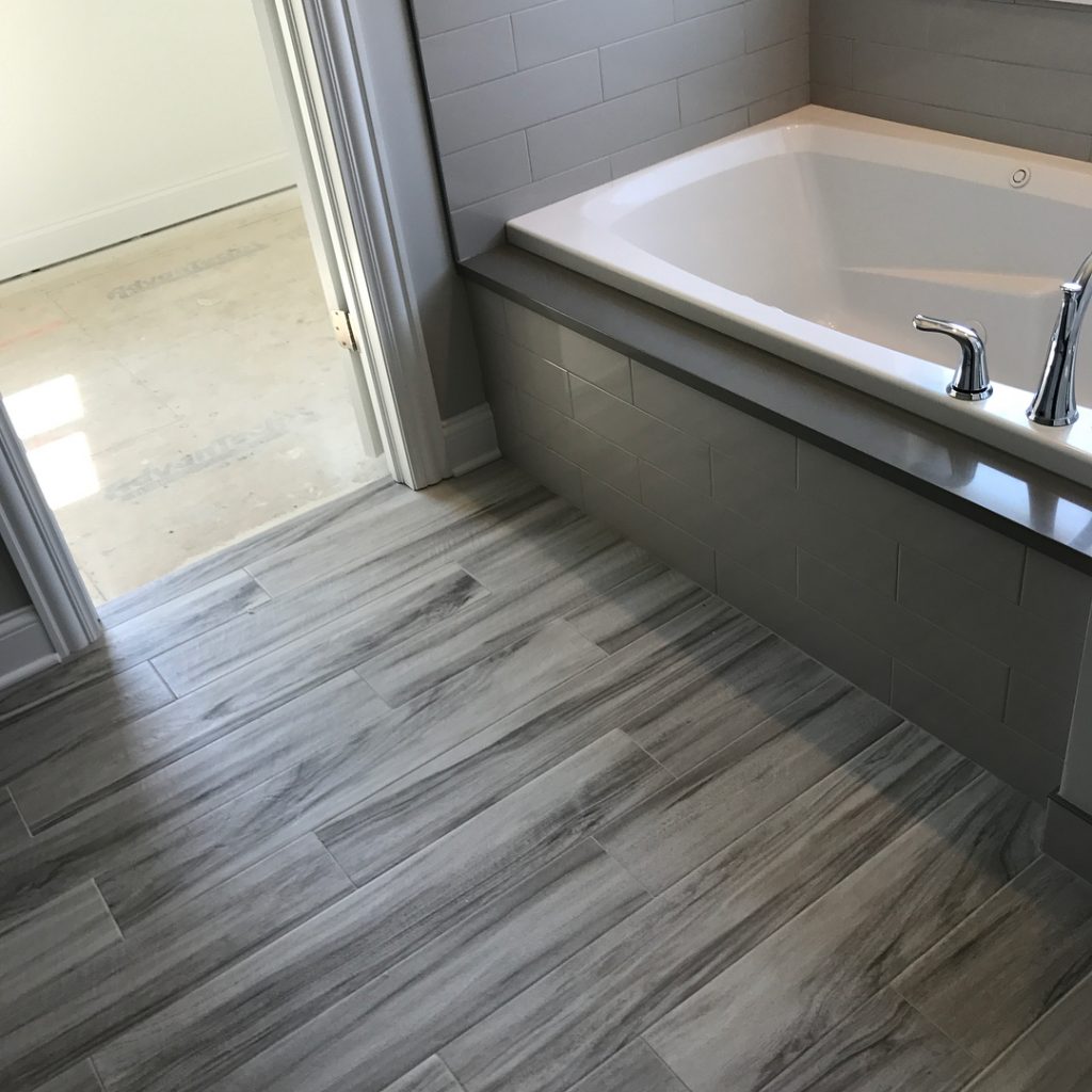 bathroom renovation wood tile floor custom tub